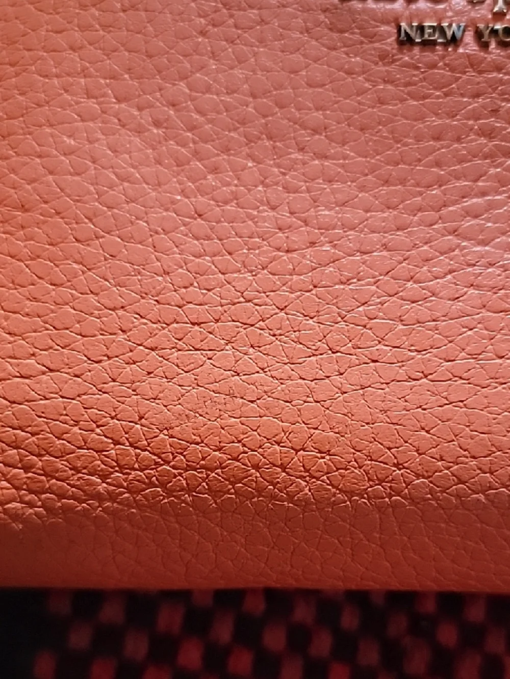 kate spade coral orange pebble leather zip-around wallet